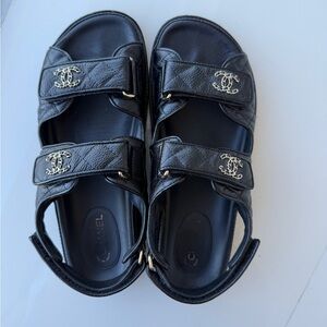 CHANEL Black dad Sandals with Gold Accents
